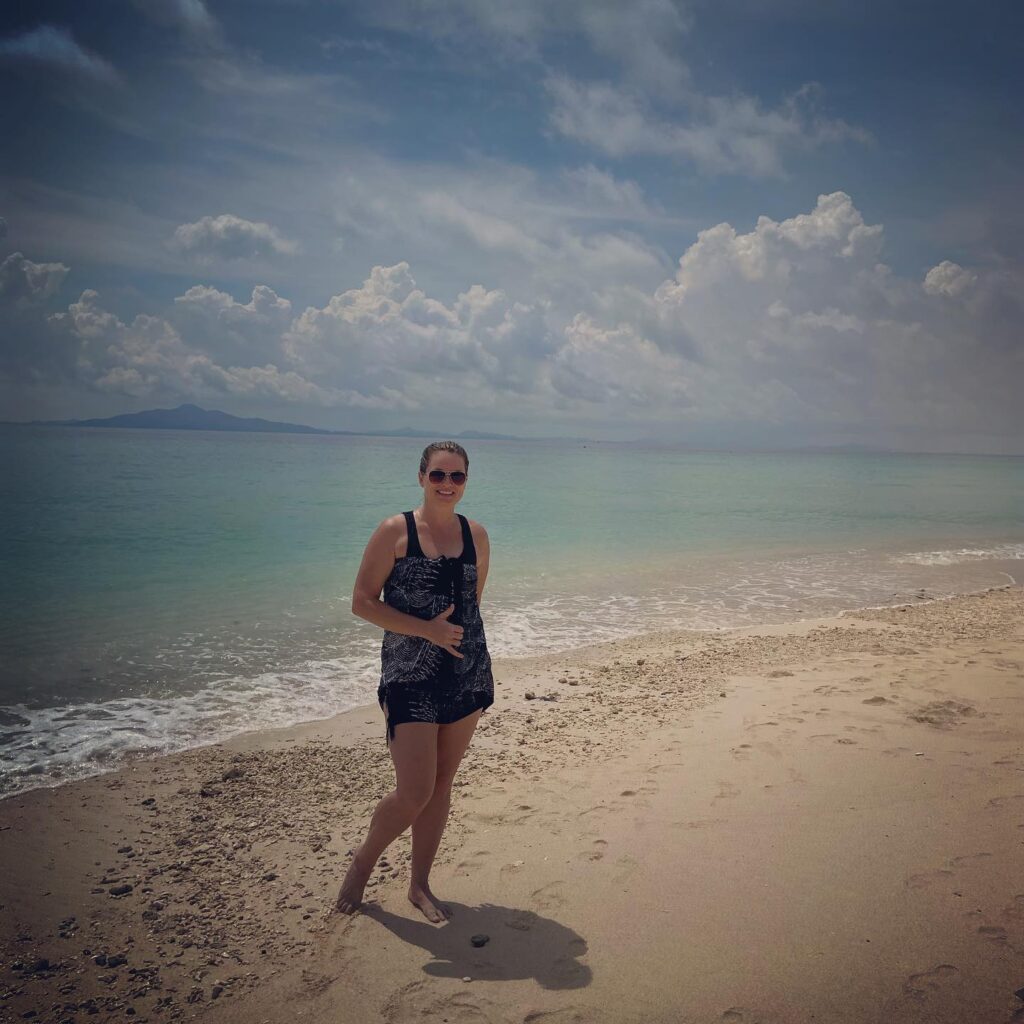 Photo of the author on the beach in Thailand